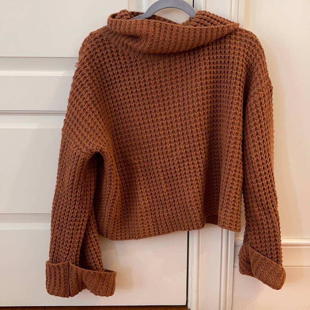 orange knitted turtle neck sweater